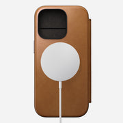 Front view of Modern Leather Folio for iPhone 16 Pro in English Tan-C by Nomad Leather. Features full-grain leather with 3 card slots, 1 cash slot, and a removable magnetic clasp. Includes 8ft drop protection and is compatible with MagSafe & wireless charging