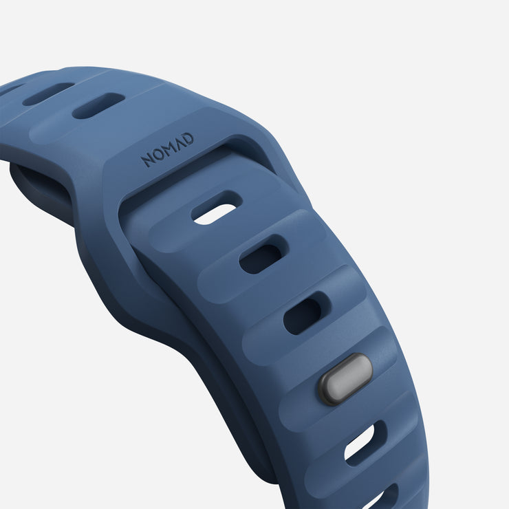 Close-up view of the 45mm Naval Blue Sport Band, highlighting the texture of the FKM fluoroelastomer rubber