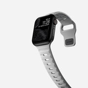 Side view of the Sport Band in Lunar Gray, showcasing the custom aluminum closure pin and its sleek design