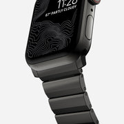 Close-up of the Steel Band for Apple Watch in graphite, highlighting the fine detailing and custom fit