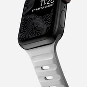 Close-up view of the Sport Band for 41mm Apple Watch in Lunar Gray, highlighting the texture and detail of the FKM fluoroelastomer rubber