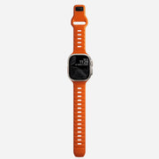 Whole view of the Sport Band for Apple Watch in Ultra Orange, demonstrating its full length and design