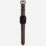 Whole view of the Traditional Band for Apple Watch, demonstrating the full length and design in Rustic Brown Horween leather with Black Hardware 